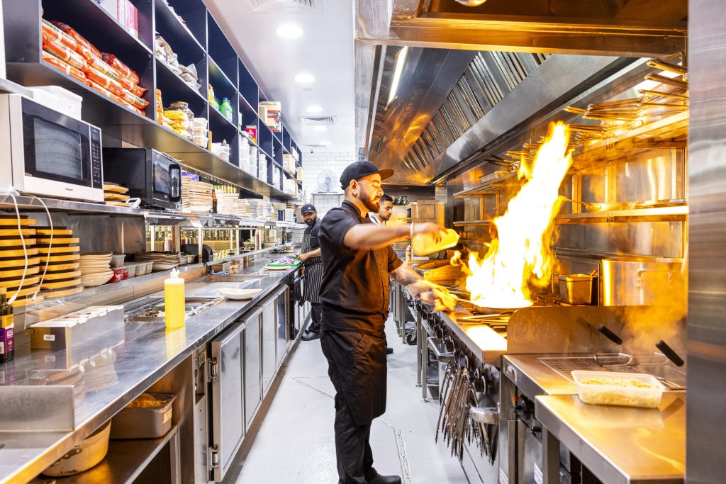 chefs cooking in kitchen