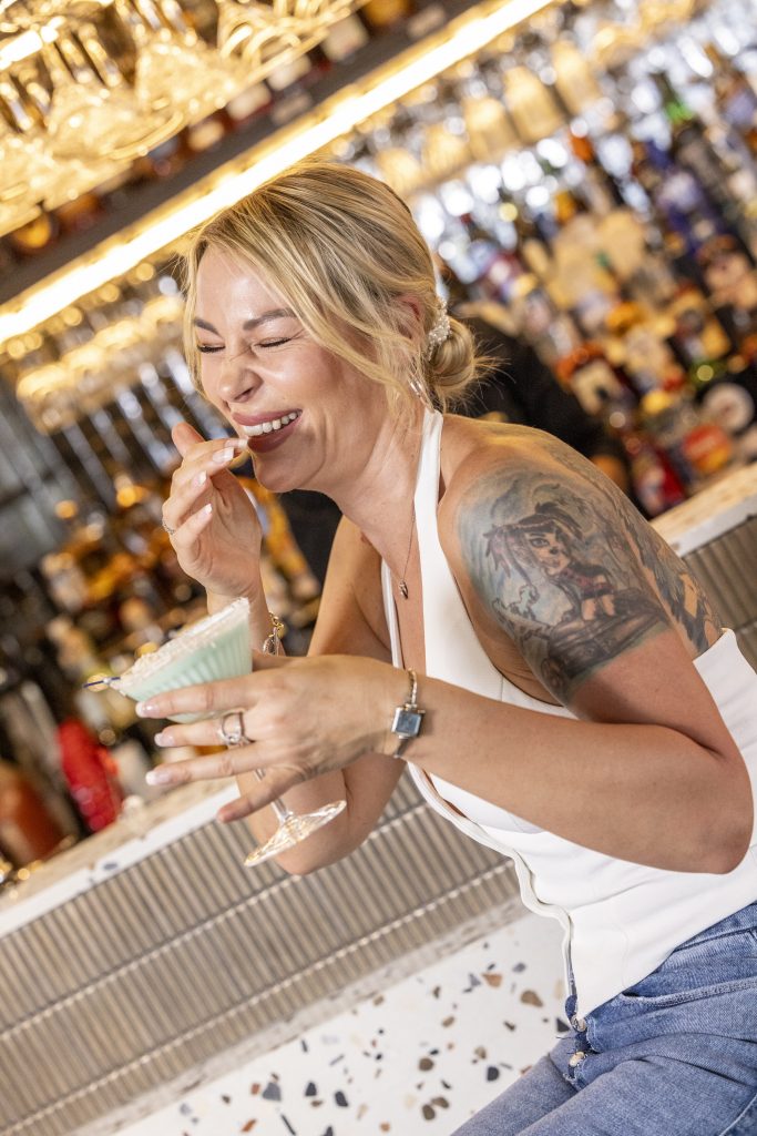 woman laughing at martini and co bar