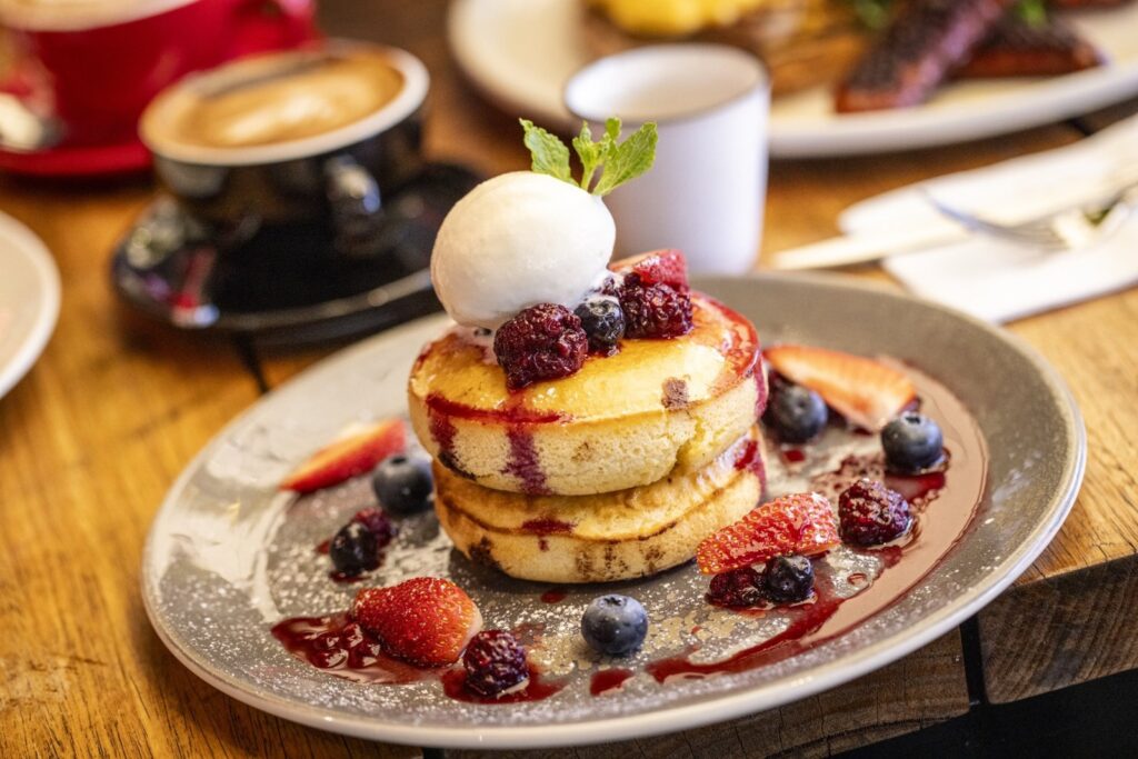 Choc chip pancakes with berries and ice cream
